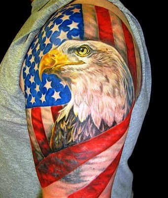 Eagle wrapped in american flag tattoo