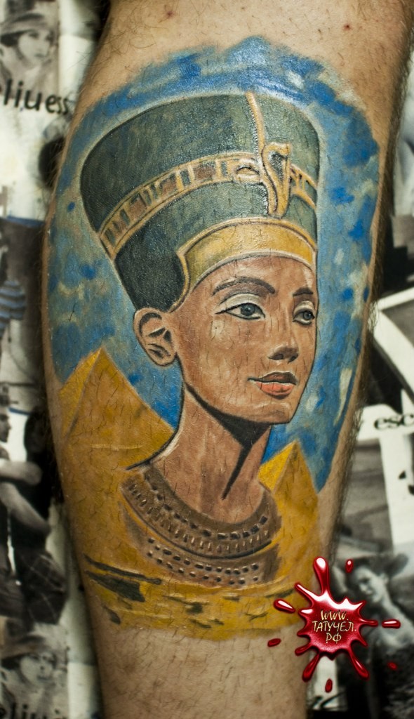Egyptian pyramids and Nefertiti princess naturally colored realistic tattoo on calf