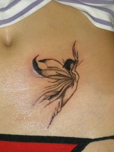 Elegant black fairy hip tattoo