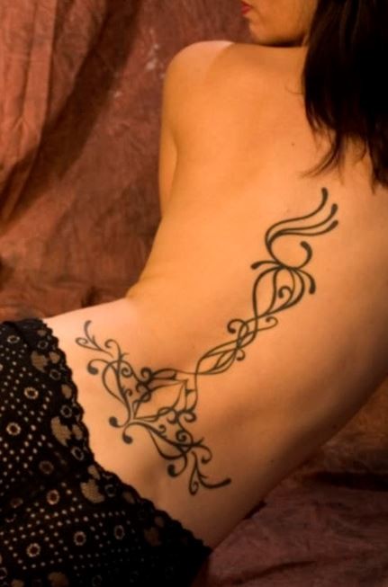 Elegant black patterns tattoo on back and lower back
