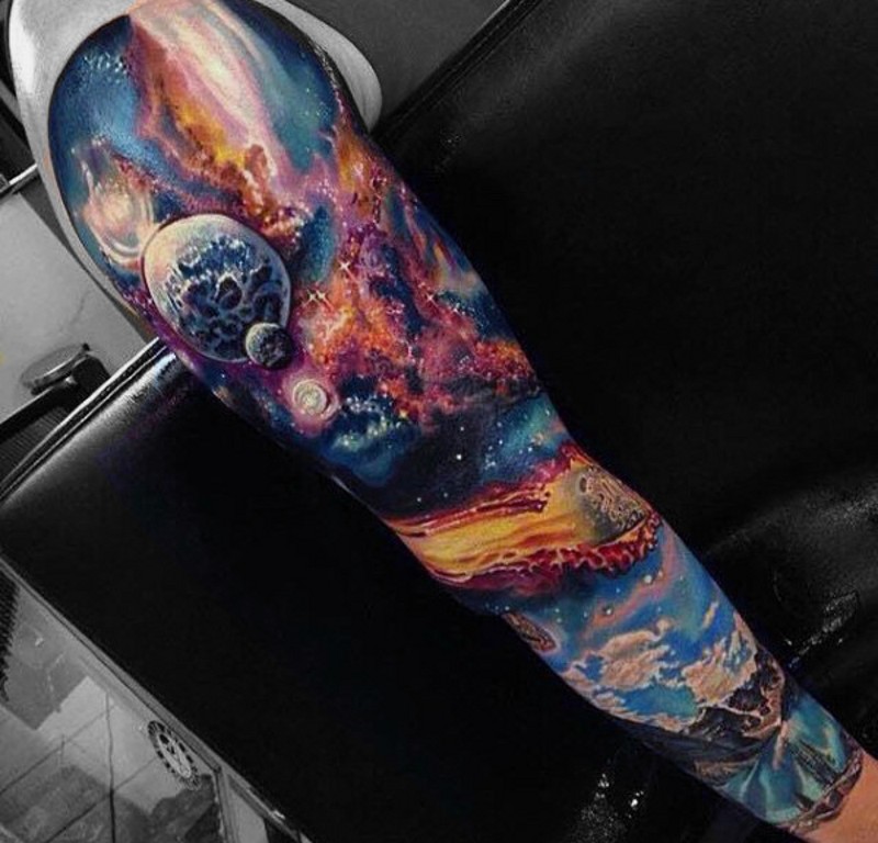 Elegant colored big space themed tattoo on sleeve