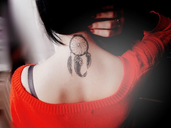 Elegant dream catcher with feather tattoo on neck and upper back