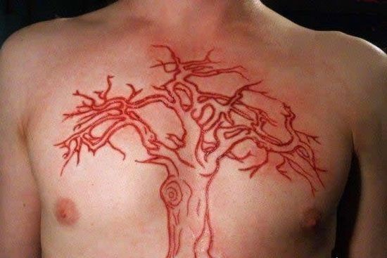 Elegant skin scarification tree on chest