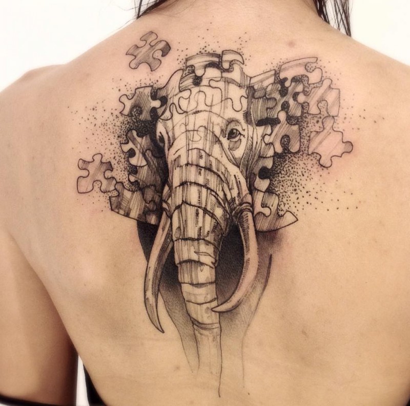 Elephant with puzzle pieces and dotes back tattoo in futuristic style