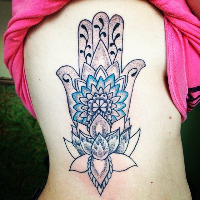 Engraving like colored Hinduism themed Hamsa hand symbol tattoo on side