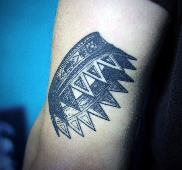Engraving style black and white arm tattoo of big crown