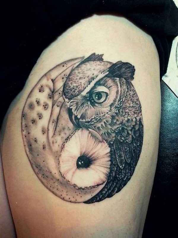 Engraving style black and white detailed thigh tattoo of owls
