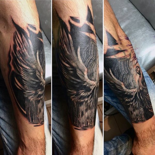 Engraving style black and white forearm tattoo of mysterious angel