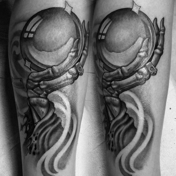Engraving style black in tattoo of fantasy hand with orb