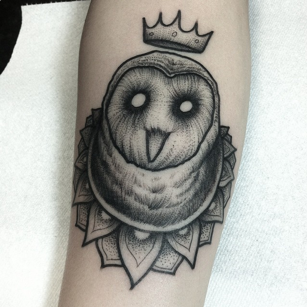 Engraving style black ink arm tattoo of owl with crown