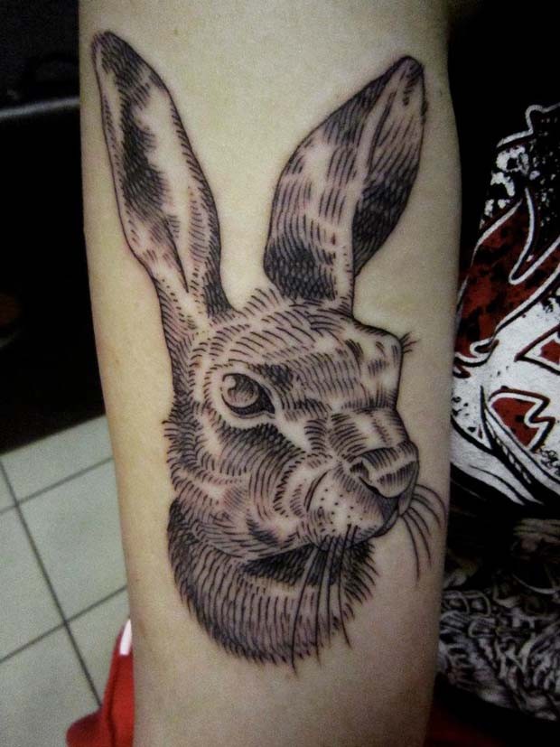 Engraving style black ink arm tattoo of cute rabbit