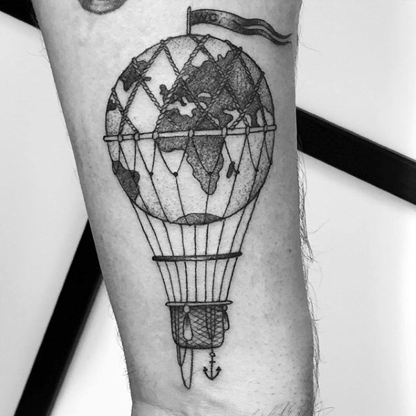 Engraving style black ink arm tattoo of balloon stylized with planet Earth