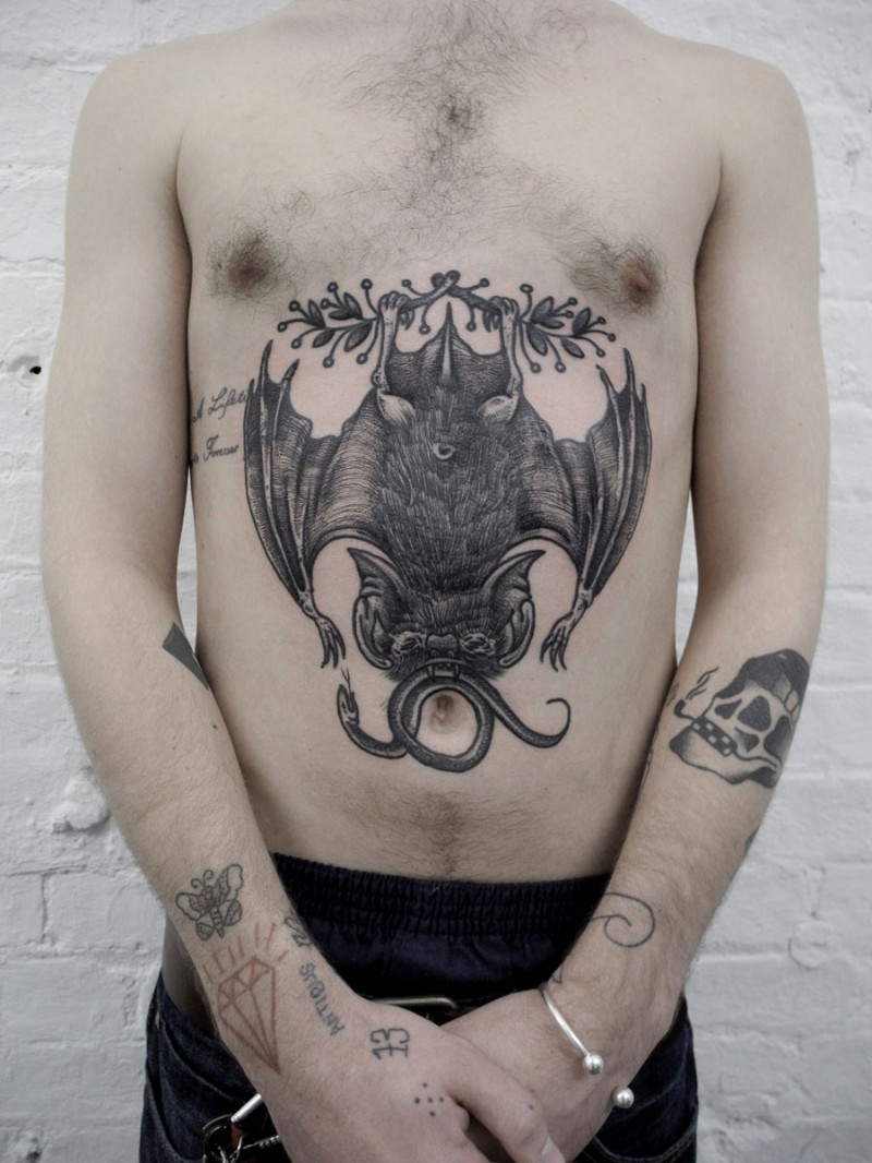 Engraving style black ink bat with snake tattoo on belly