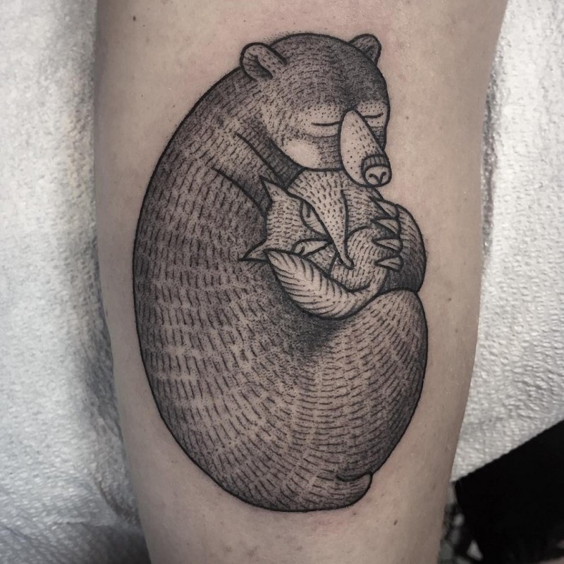 Engraving style black ink bear with fox tattoo
