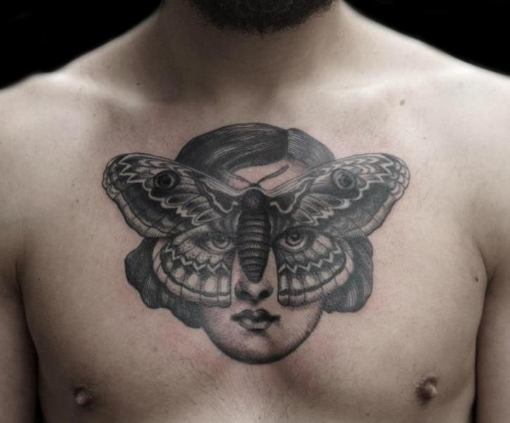 Engraving style black ink chest tattoo of woman face with butterfly shaped mask