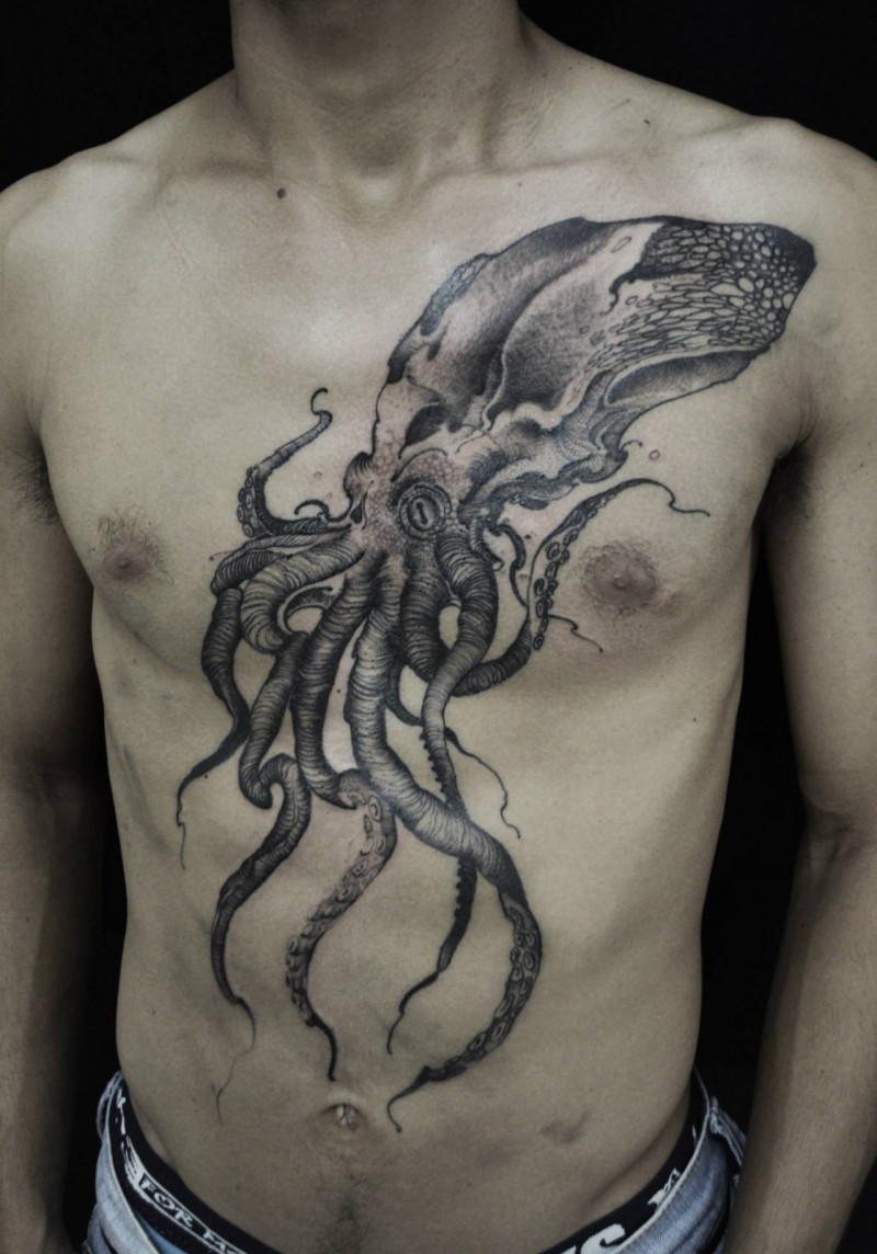 Engraving style black ink chest tattoo of large octopus