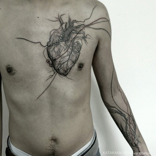 Engraving style black ink chest tattoo of gorgeous human heart