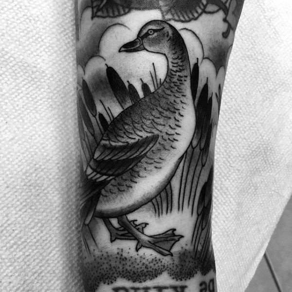 Engraving style black ink duck tattoo