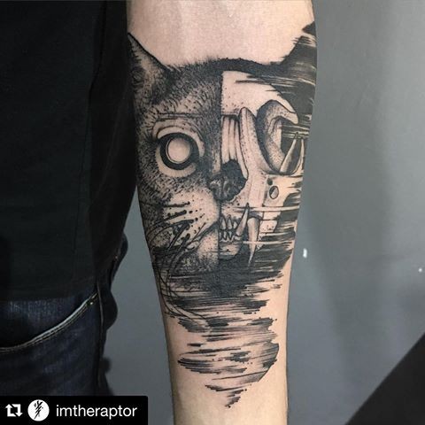 Engraving style black ink forearm tattoo of cat head stylized with skull