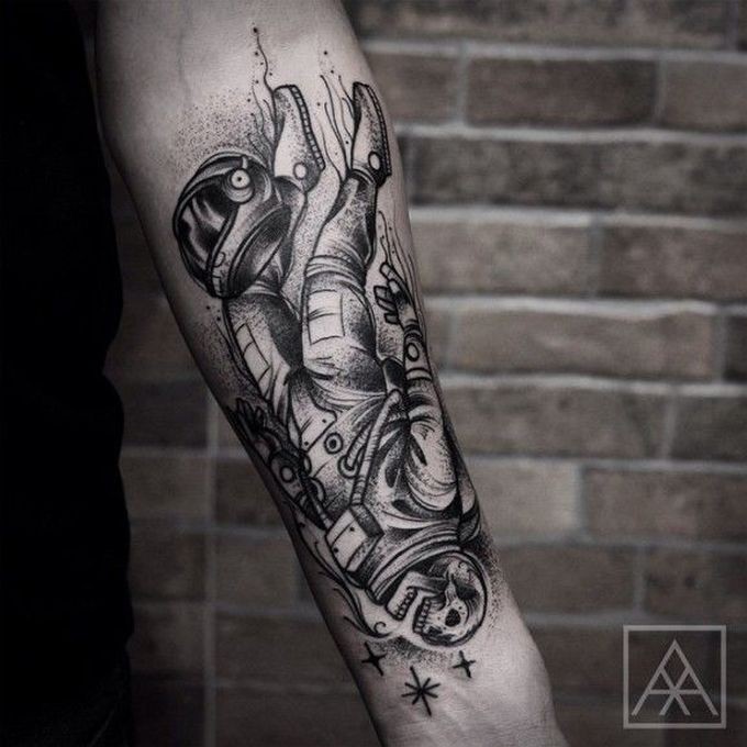 Engraving style black ink forearm tattoo of dead astronaut skeleton