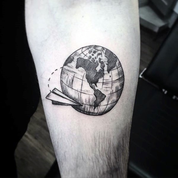 Engraving style black ink forearm tattoo of globe with paper plane