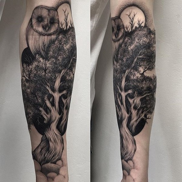 Engraving style black ink forearm tattoo of tree with owl
