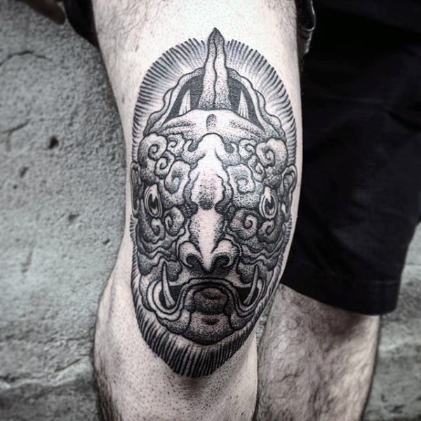 Engraving style black ink knee tattoo of demonic head face