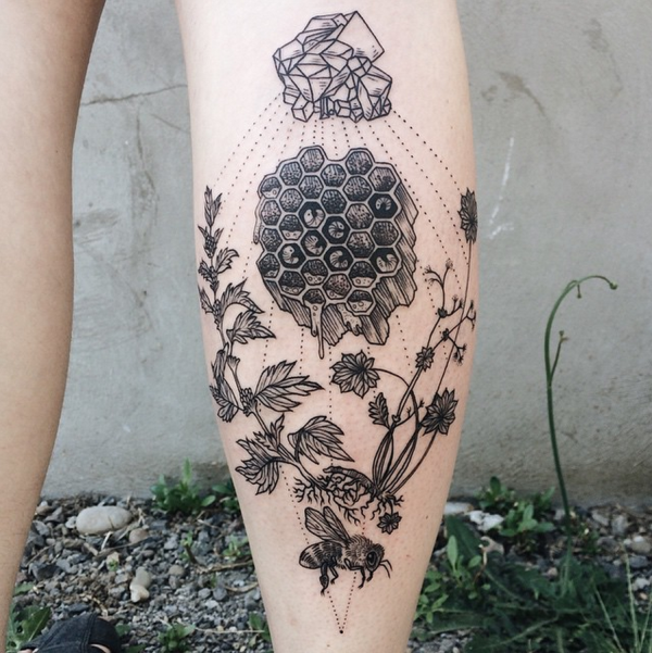Engraving style black ink leg tattoo of bee with plants