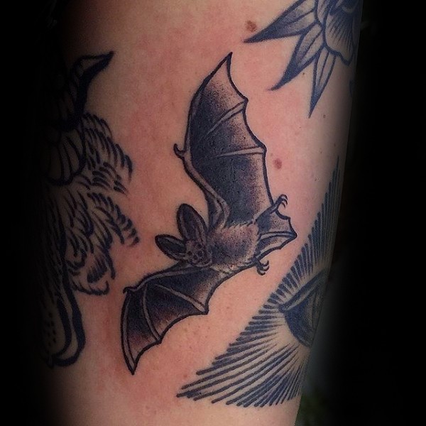 Engraving style black ink leg tattoo of flying bat
