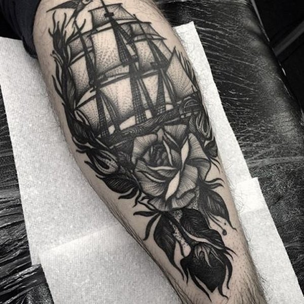 Engraving style black ink leg tattoo of sailing ship with rose
