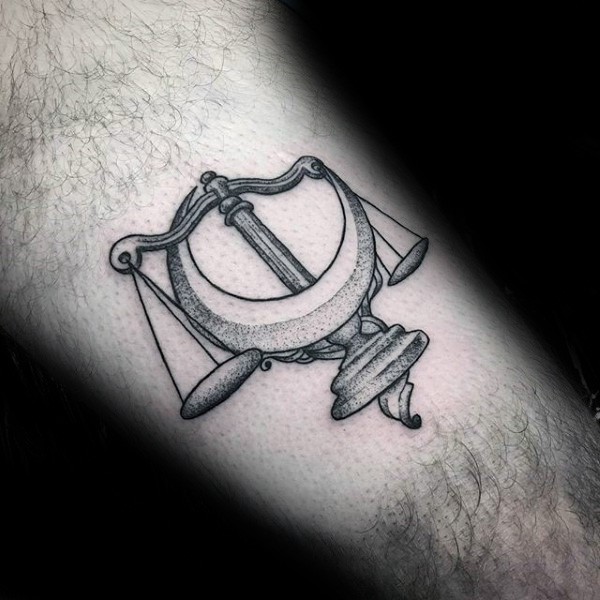 Engraving style black ink libra tattoo with moon
