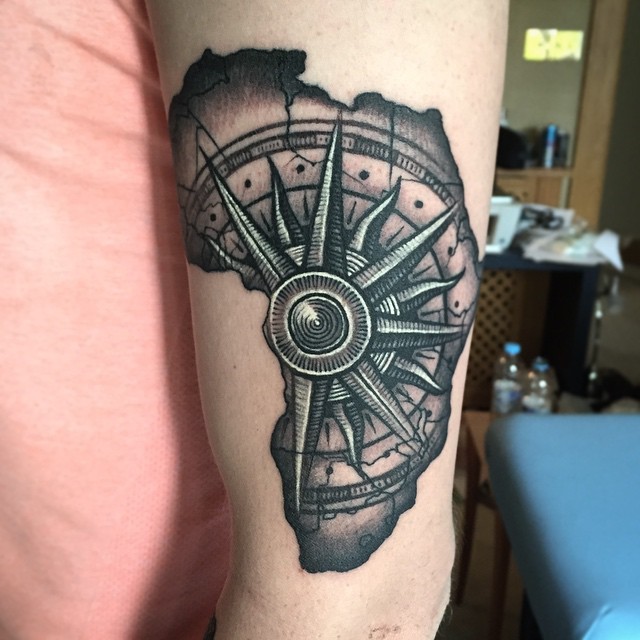 Engraving style black ink shoulder tattoo of ancient compass