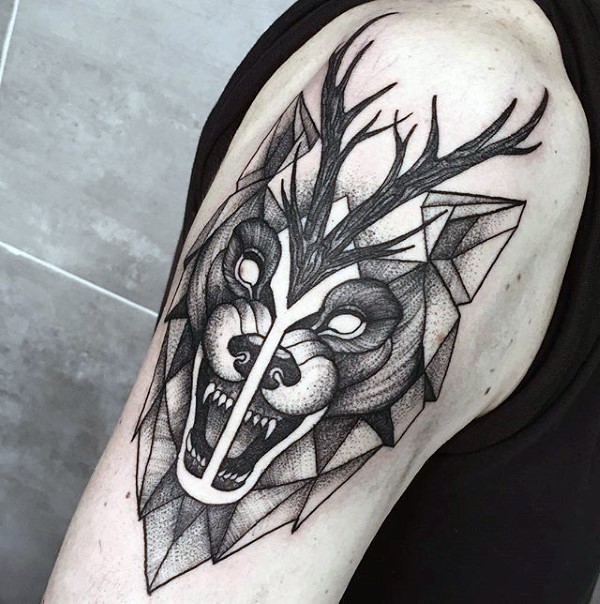 Engraving style black ink shoulder tattoo of evil wolf and deer