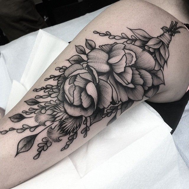 Engraving style black ink shoulder tattoo of big flowers