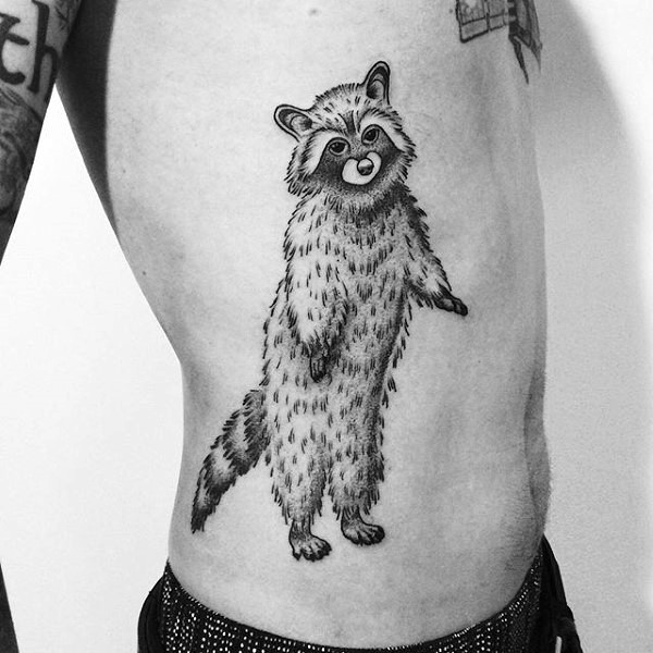Engraving style black ink side tattoo of big raccoon