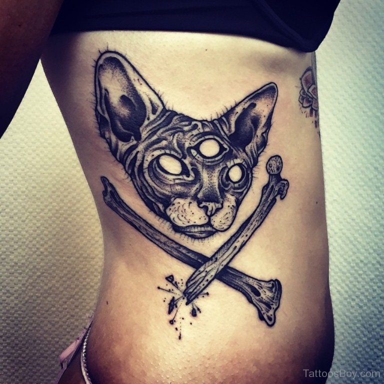 Engraving style black ink side tattoo of cat head with crossed bones