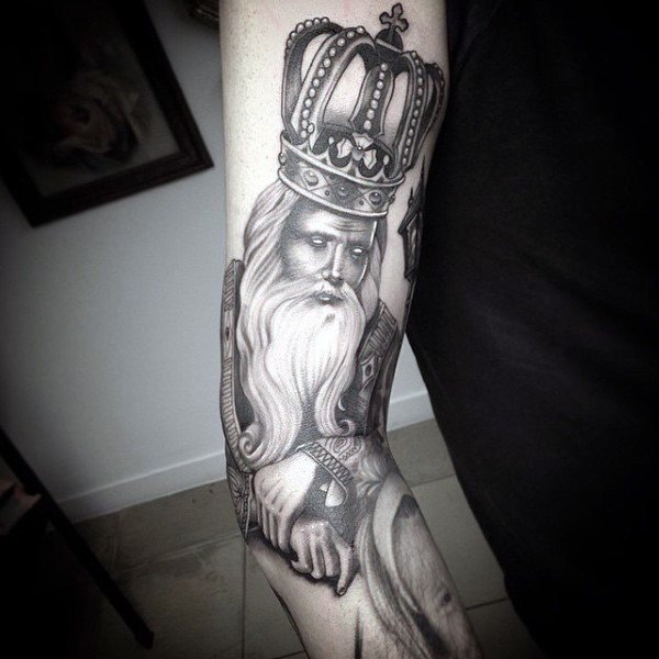 Engraving style black ink sleeve tattoo of king with big beautiful crown