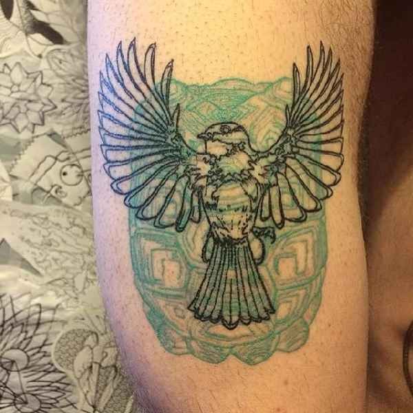 Engraving style black ink tattoo of bird and old stone statue