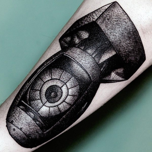 Engraving style black ink tattoo of large bomb