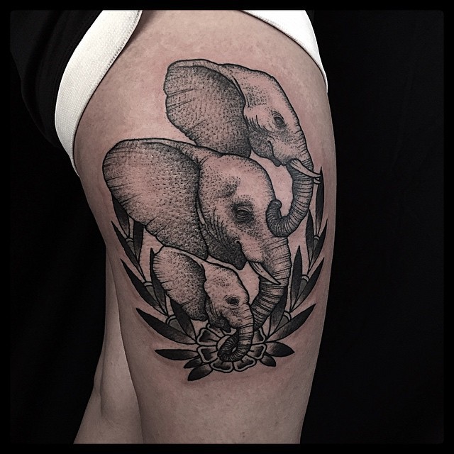 Engraving style black ink thigh tattoo of elephant family