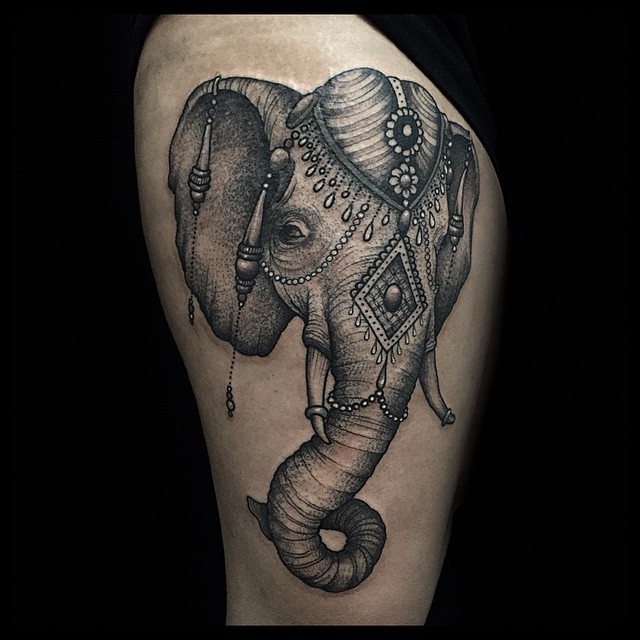 Engraving style black ink thigh tattoo of saint elephant