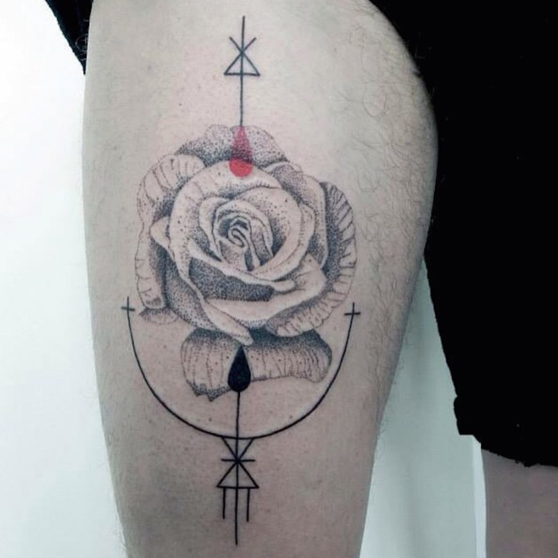 Engraving style black ink thigh tattoo of big rose with interesting symbols