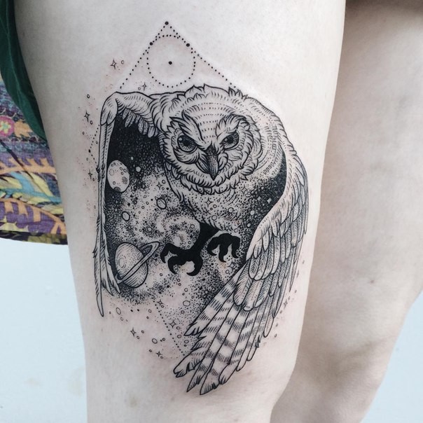 Engraving style black ink thigh tattoo of owl with solar system
