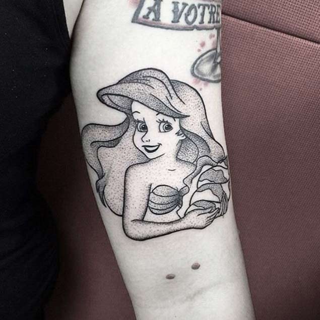 Engraving style black ink tiny arm tattoo of smiling Ariel mermaid