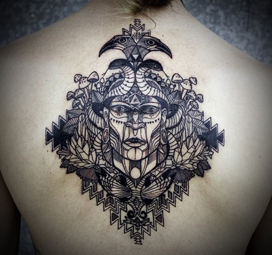 Engraving style black ink upper back tattoo of mystical face with birds and mushrooms