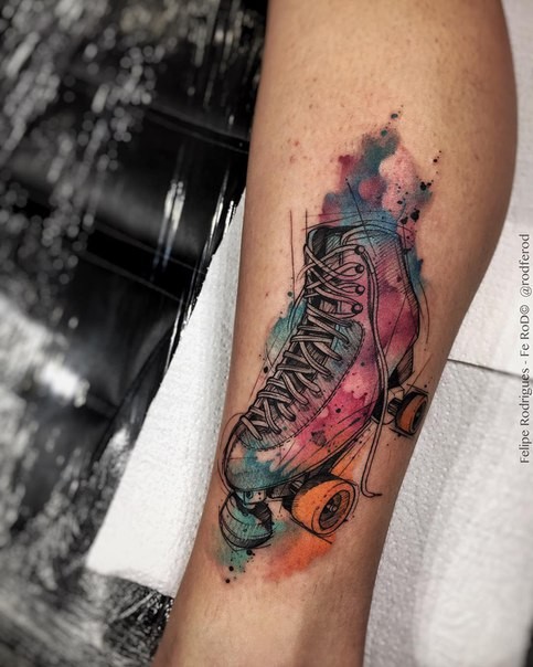 Engraving style colored leg tattoo of vintage roller