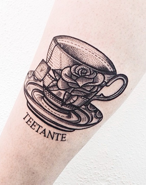 Engraving style very detailed arm tattoo of big cup of tea with lettering and roses