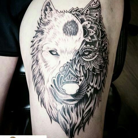 Enormous amazing looking thigh tattoo of white wolf stylized with floral ornaments