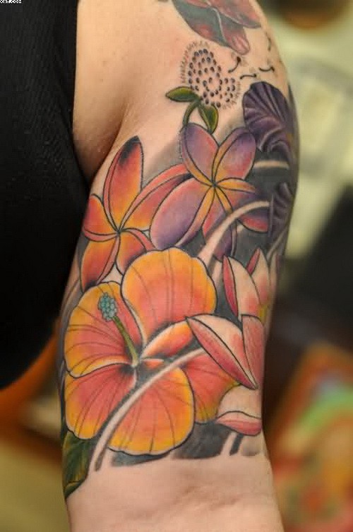 Exiting tropical hibiscus flower tattoo on arm