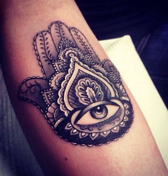 Eye in center of ornament tattoo